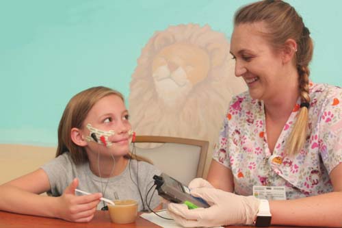 Girl receiving VitalStim therapy